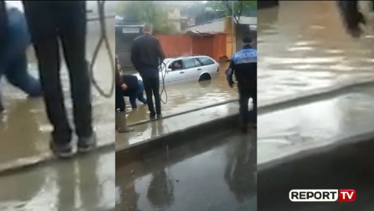 Reshje të dendura shiu/ Përmbytje pranë Ujësjellësit në Kombinat, dëmtohen dy automjete