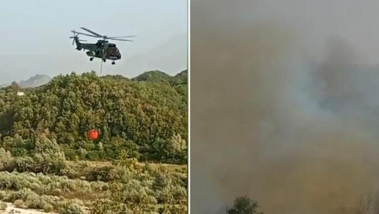 Zjarri i fuqishëm në Vranisht të Vlorës, momenti kur helikopteri furnizohet me ujë për shuarjen e flakëve