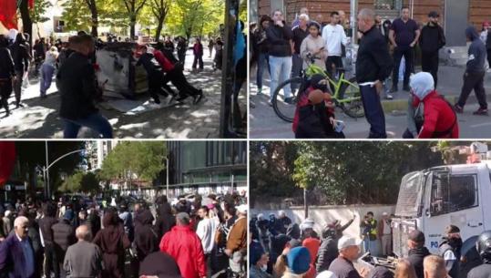 LIVE TV– Protestuesit marshim nëpër rrugët e Tiranës, të maskuarit djegin kosha e shkulin kangjella (VIDEO)
