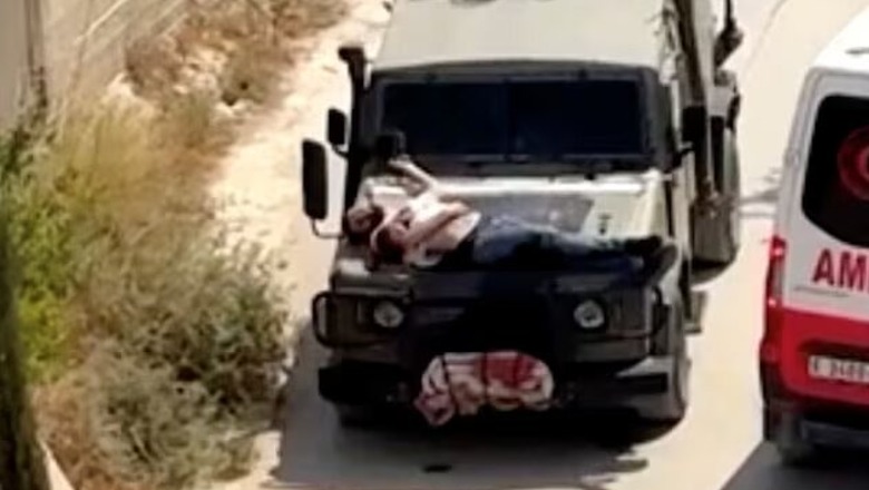FOTO/ Ushtarët izraelitë lidhin në kofanon e xhipit palestinezin e plagosur